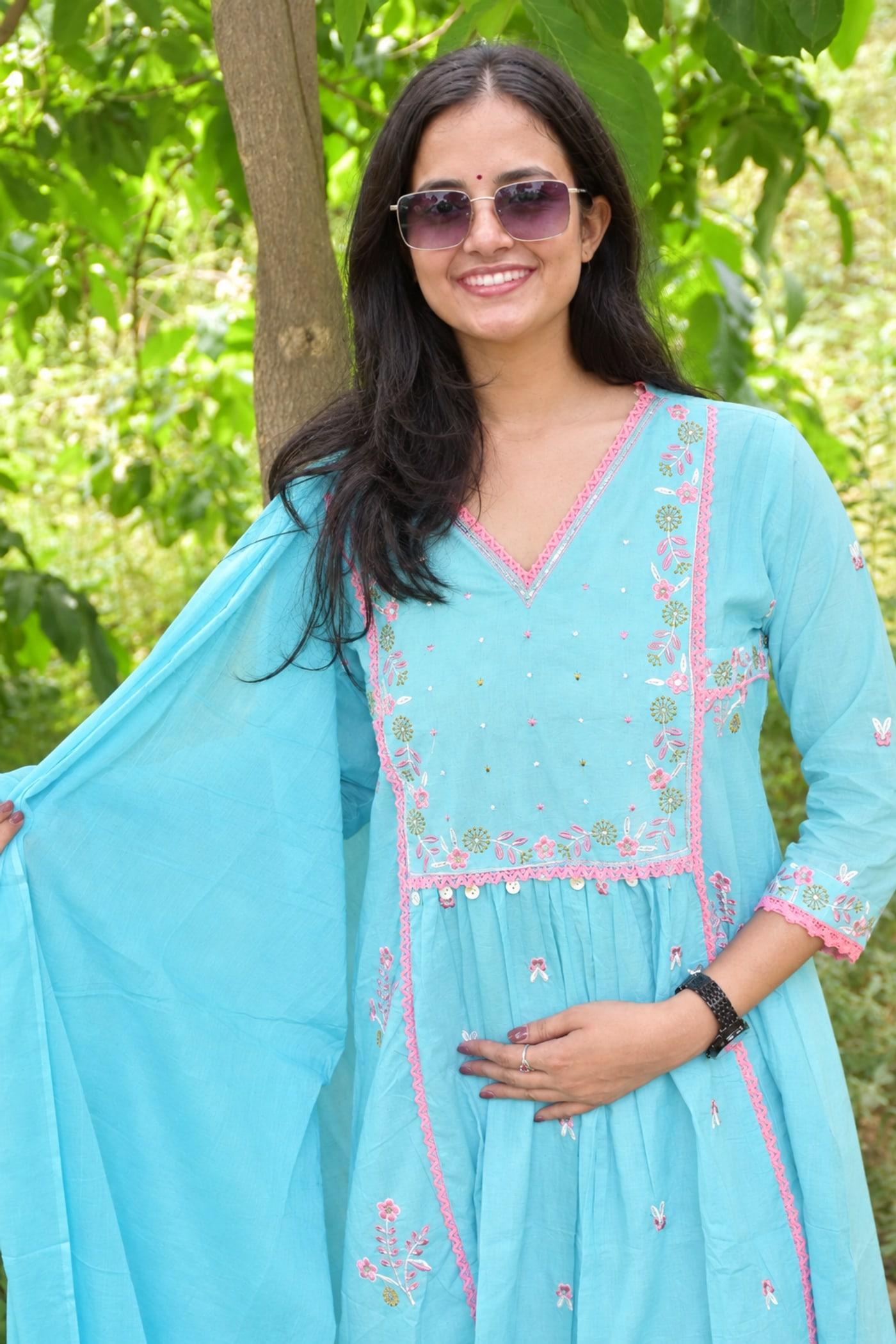 Sky Blue gathered kurta worn close, pink-embroidered yoke and dupatta held to one side
