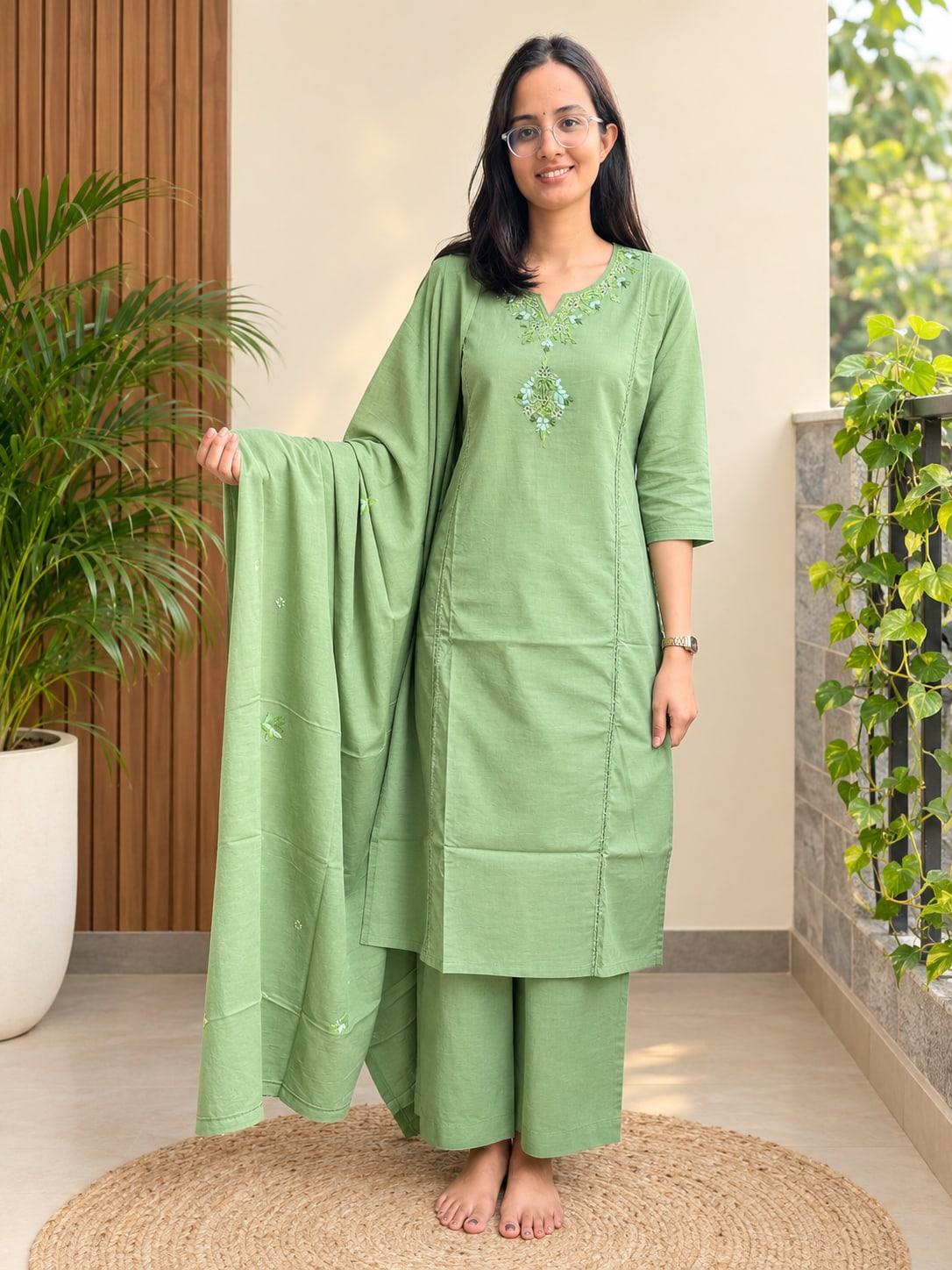 Moss Green floral embroidered suit set worn with the dupatta held open