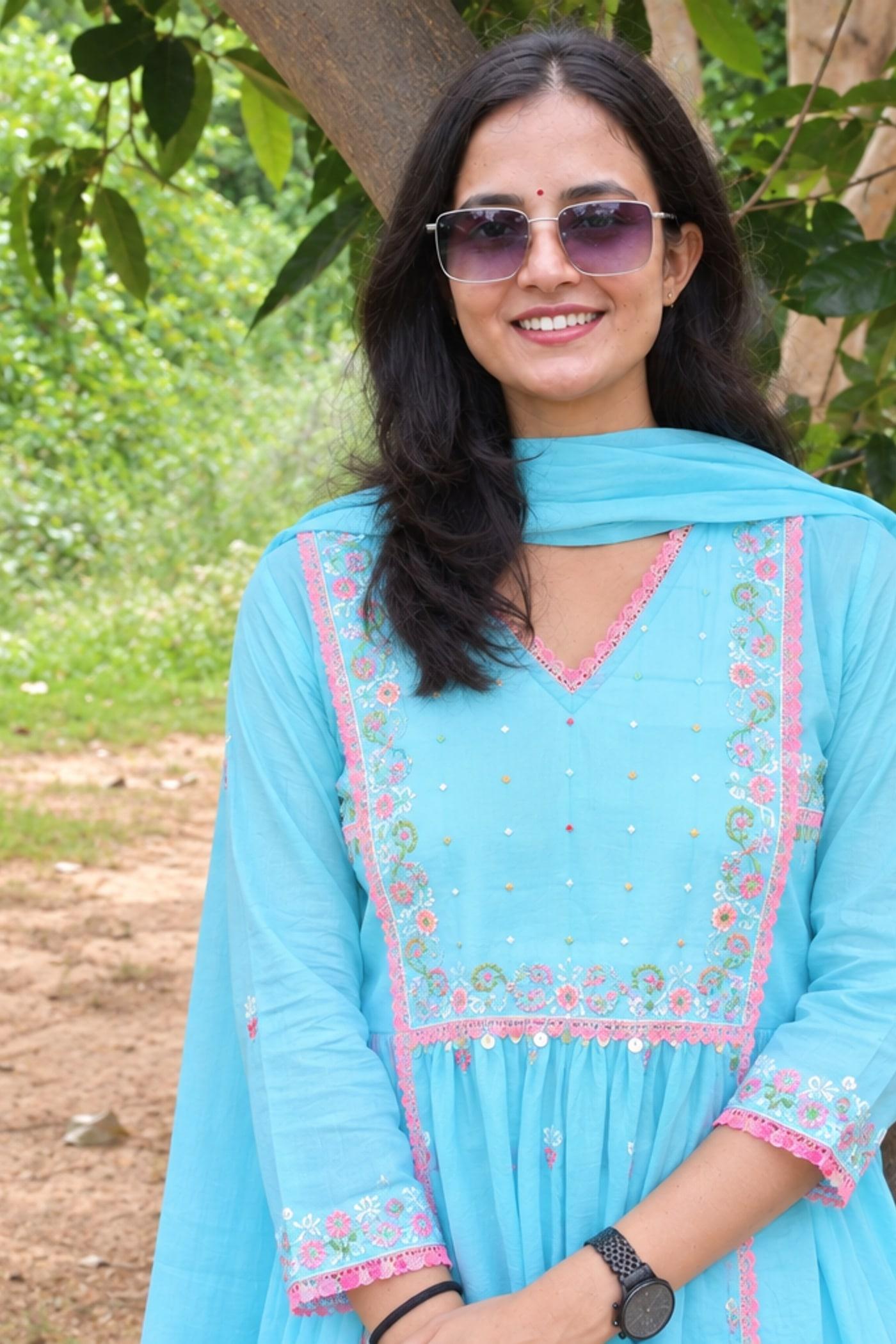 Sky Blue gathered kurta bodice close, pink embroidered border and gathered skirt in view