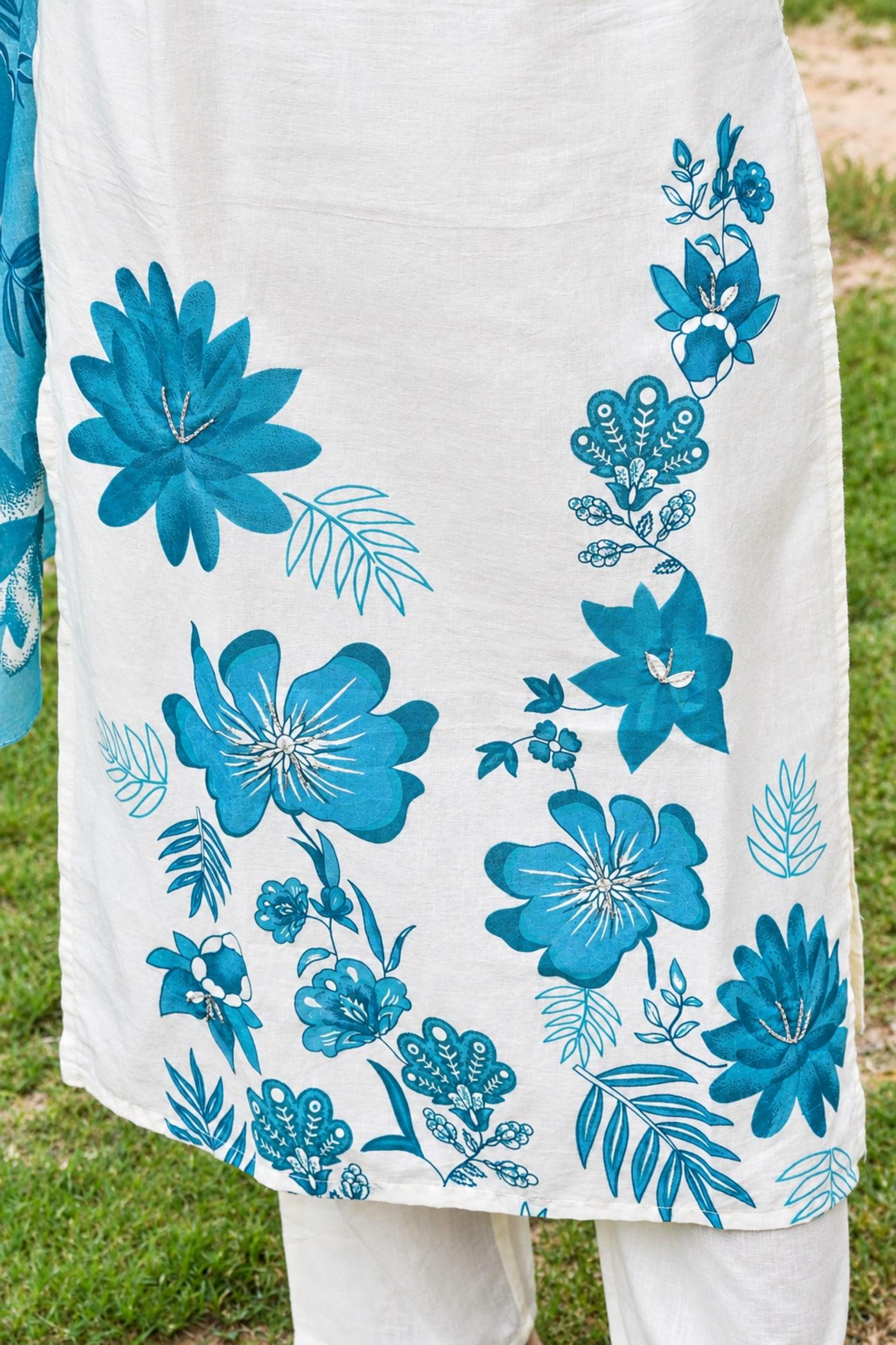 Ivory & Blue kurta hem, teal floral print in detail