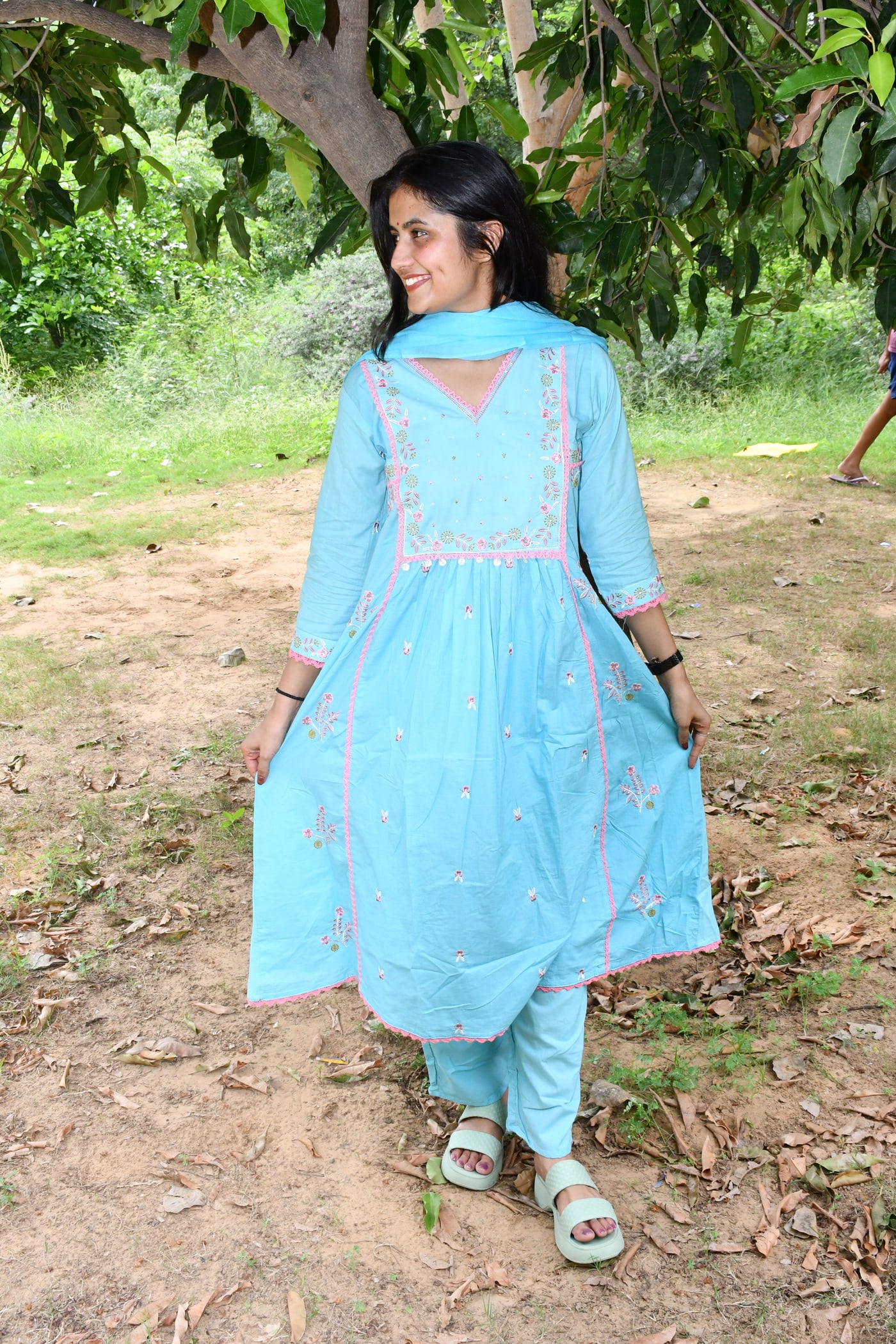 Sky Blue gathered floral suit set worn full length under a tree