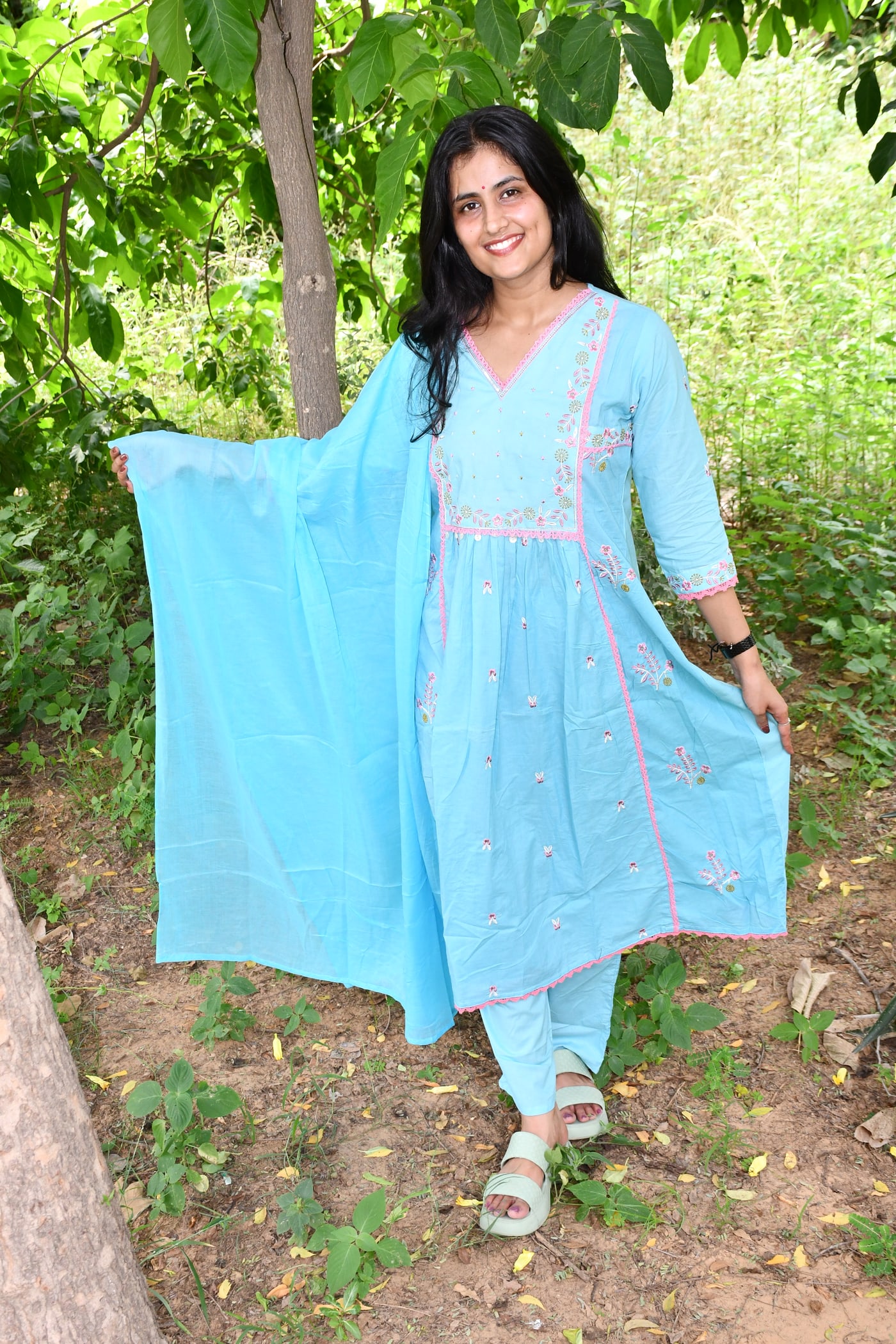 Sky Blue gathered kurta with the dupatta held out behind