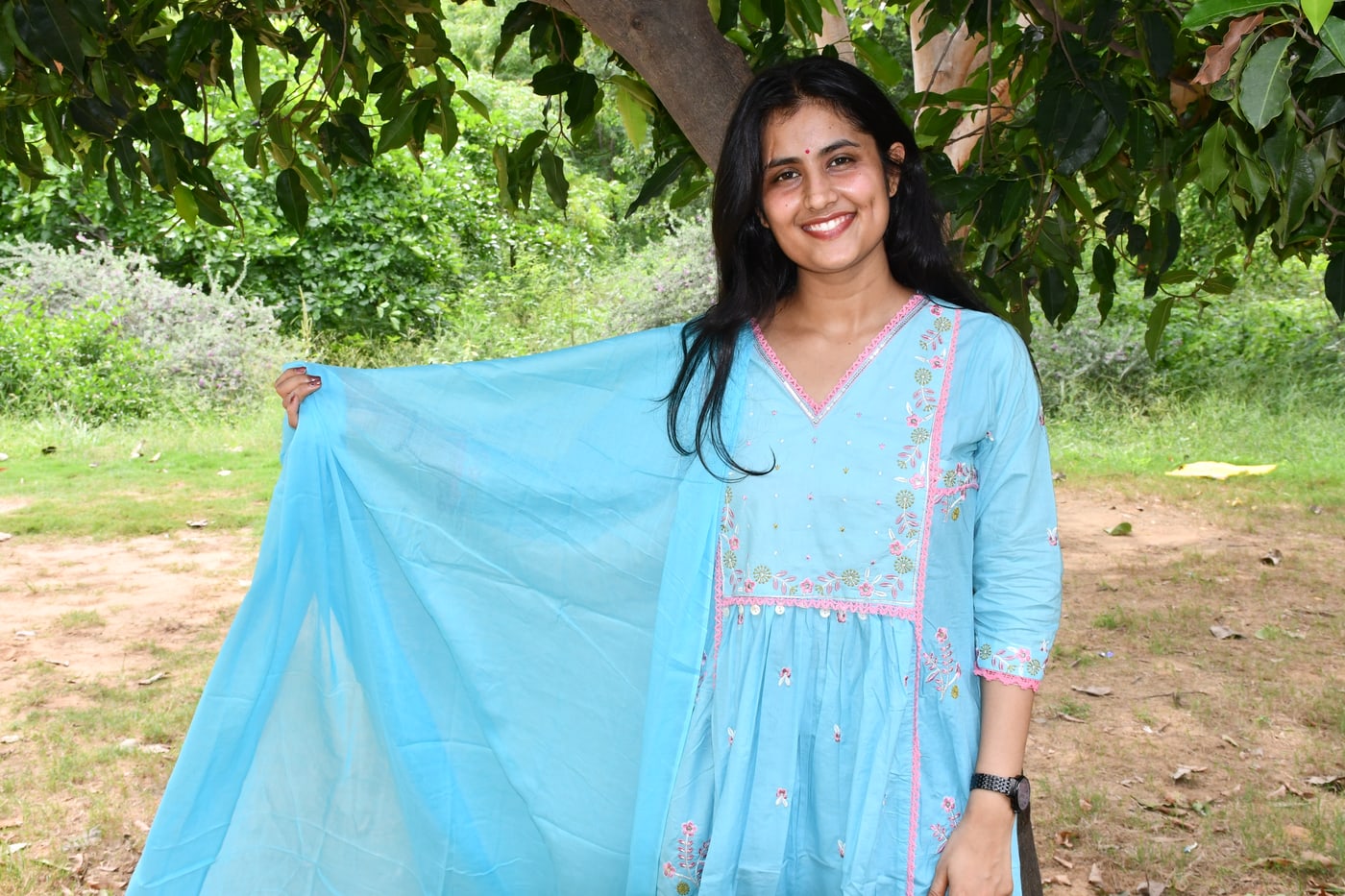 Sky Blue gathered kurta with the dupatta lifted to one side