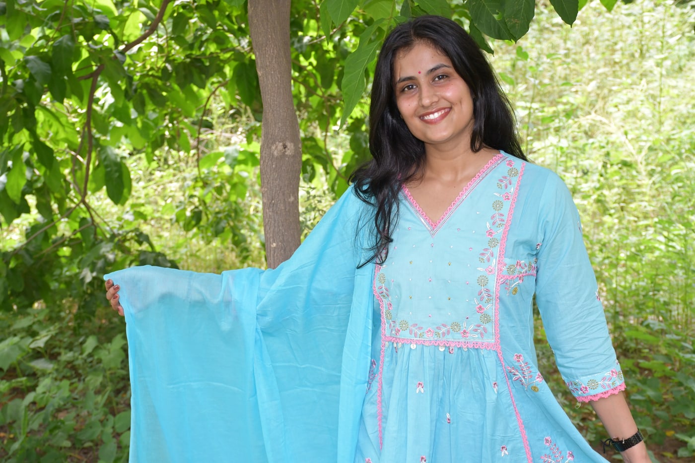 Sky Blue gathered floral kurta and dupatta seen against greenery