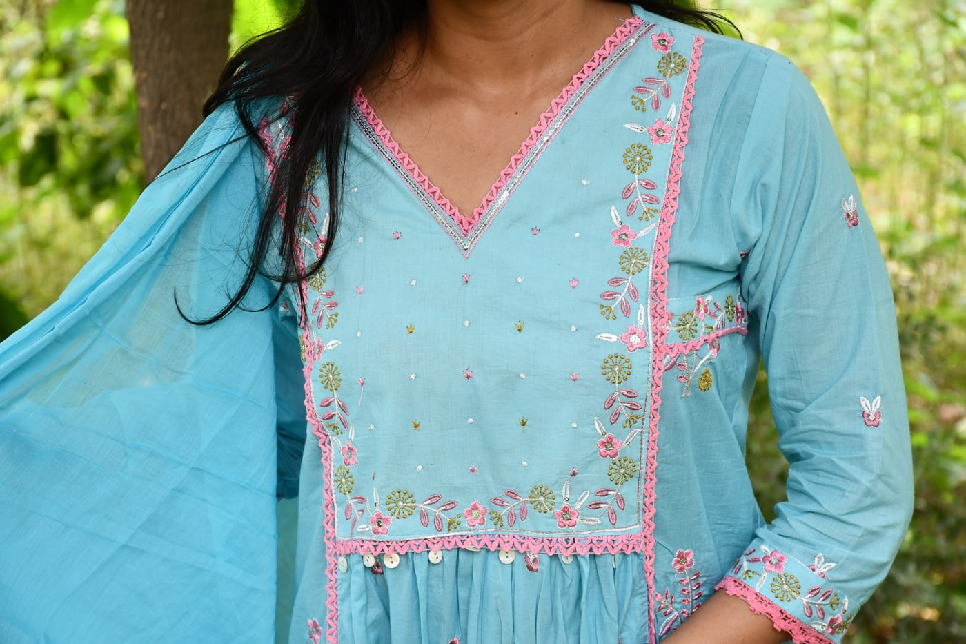 Sky Blue neckline, pastel floral embroidery in detail
