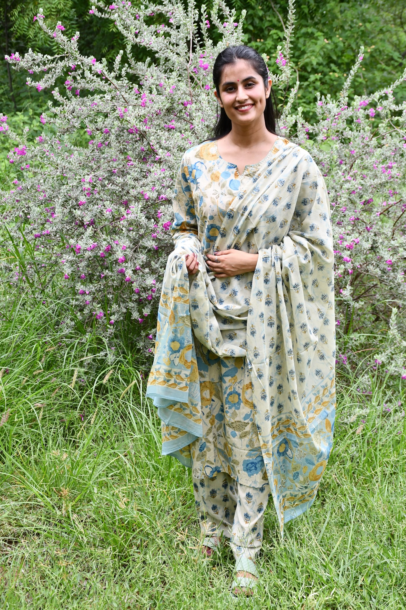 Ivory block print suit set worn full length, dupatta wrapped across