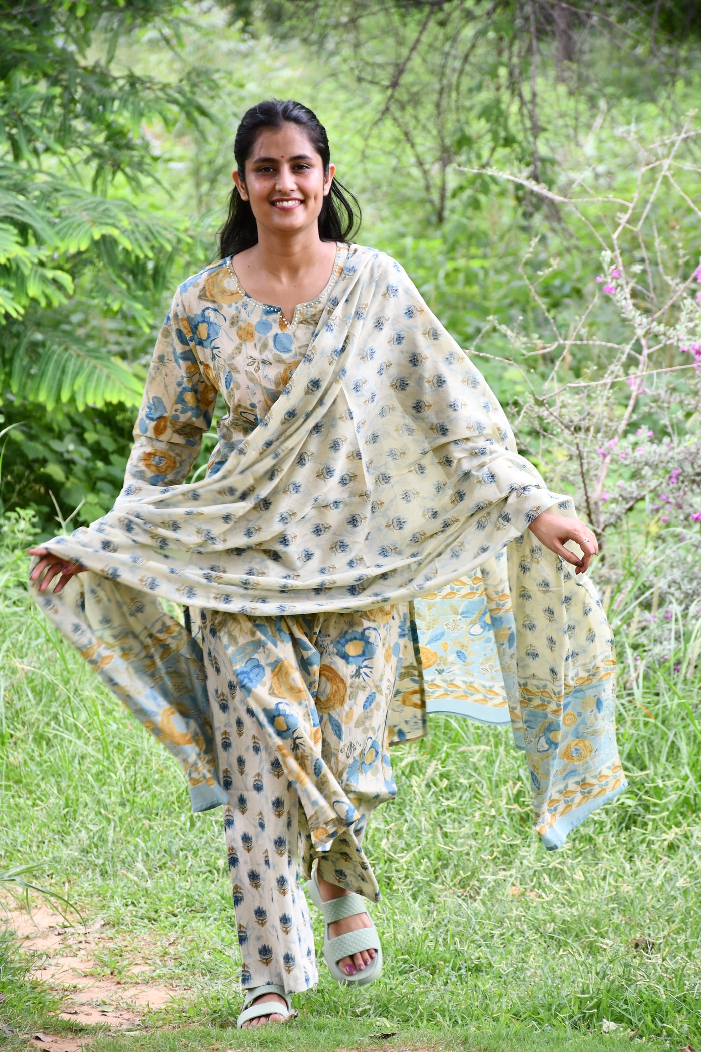 Ivory block print kurta and pant with the dupatta held out
