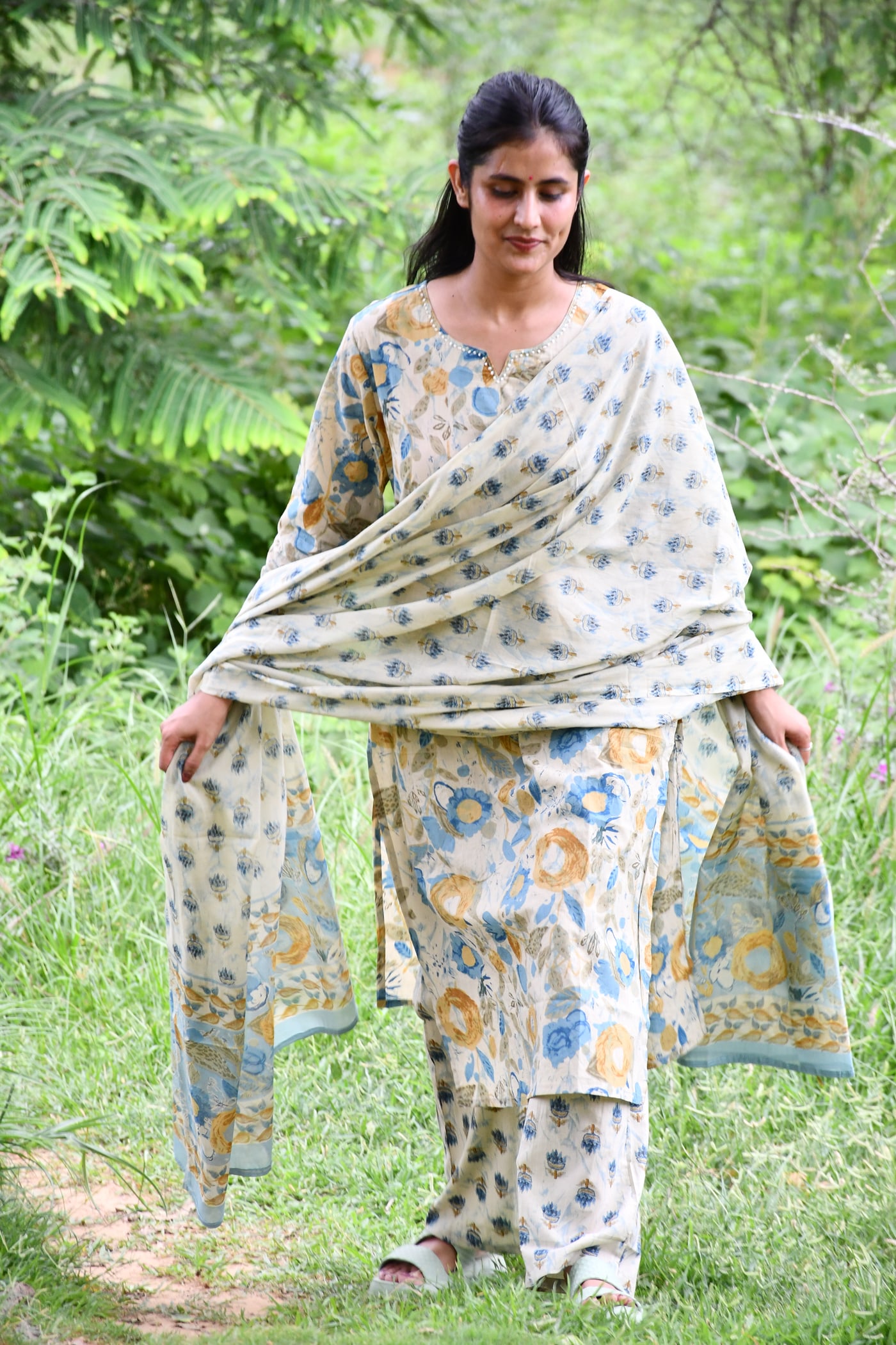 Ivory block print kurta with the dupatta drawn over one shoulder