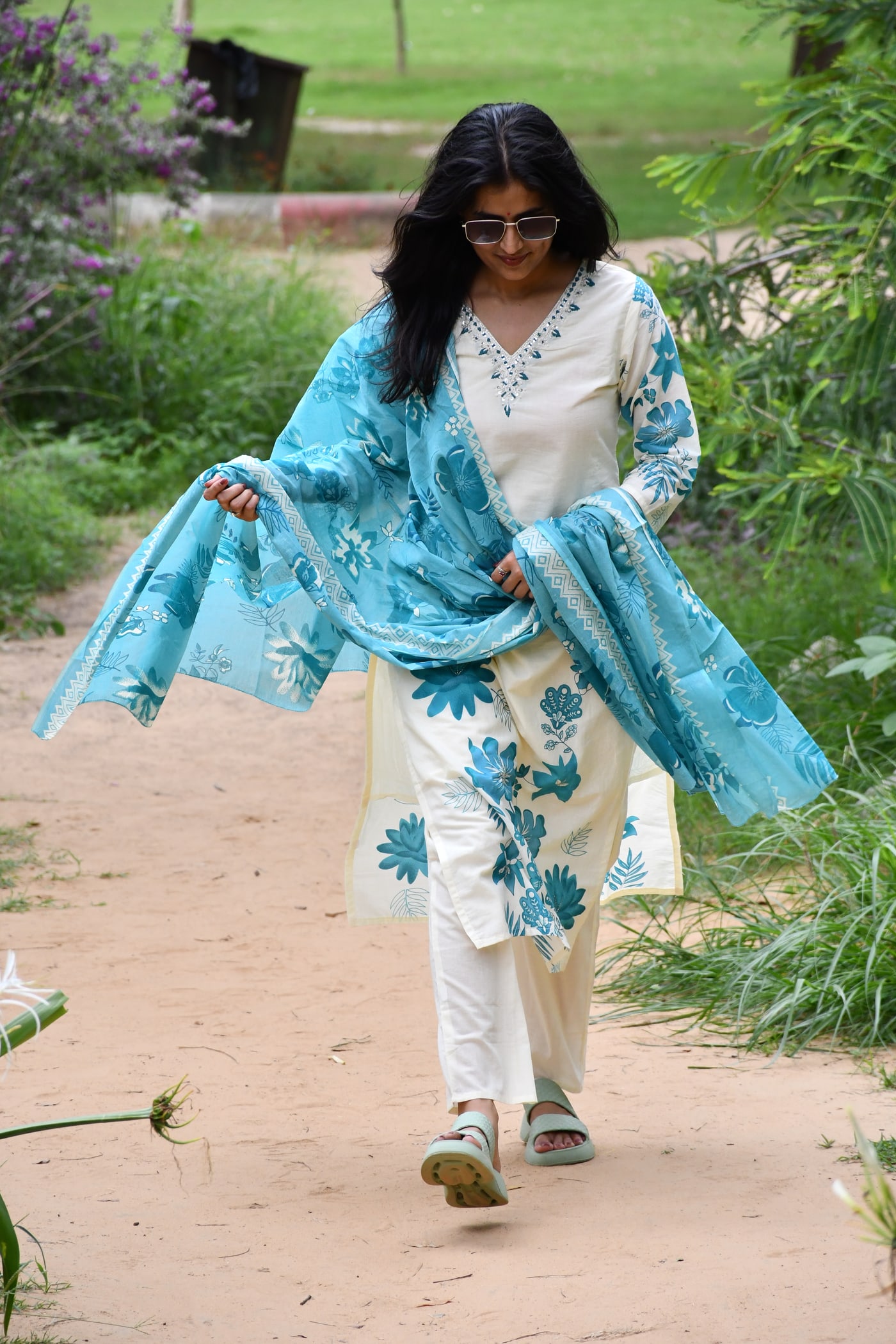 Ivory suit set seen full length from a distance