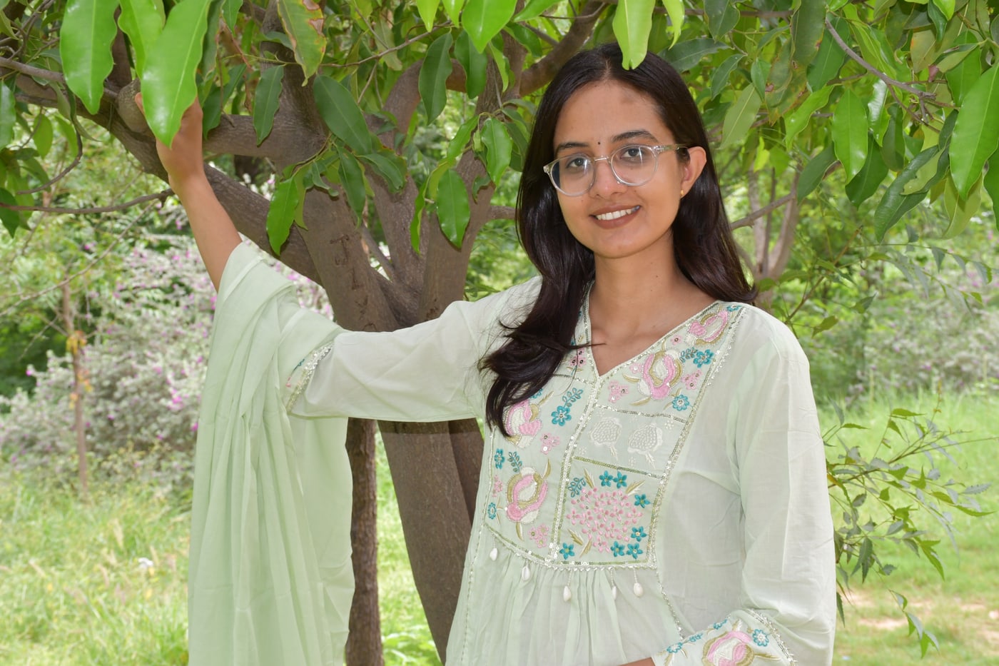 Mint pastel paisley suit set with the dupatta over one arm