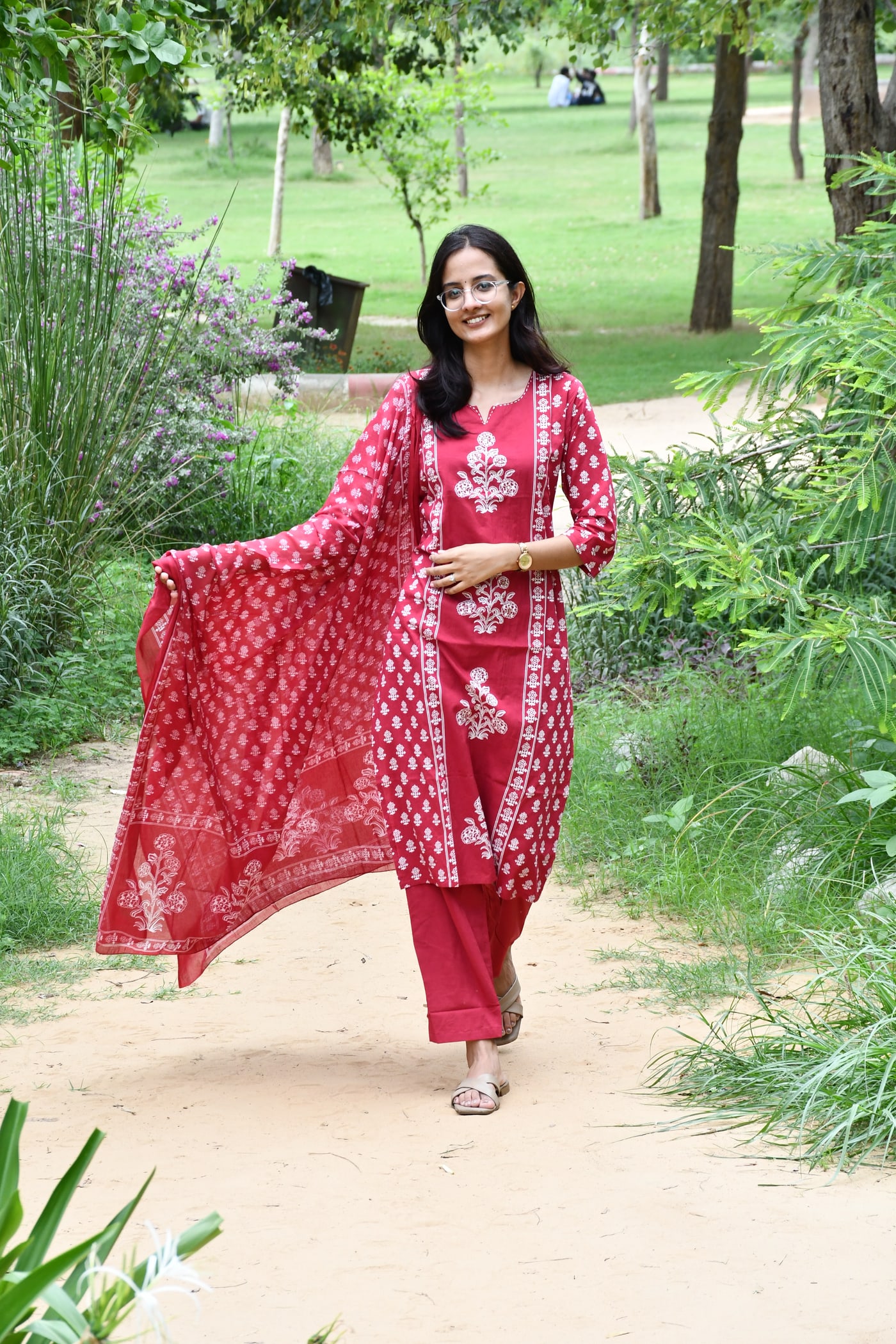Rani Pink block print kurta with the dupatta caught mid-air