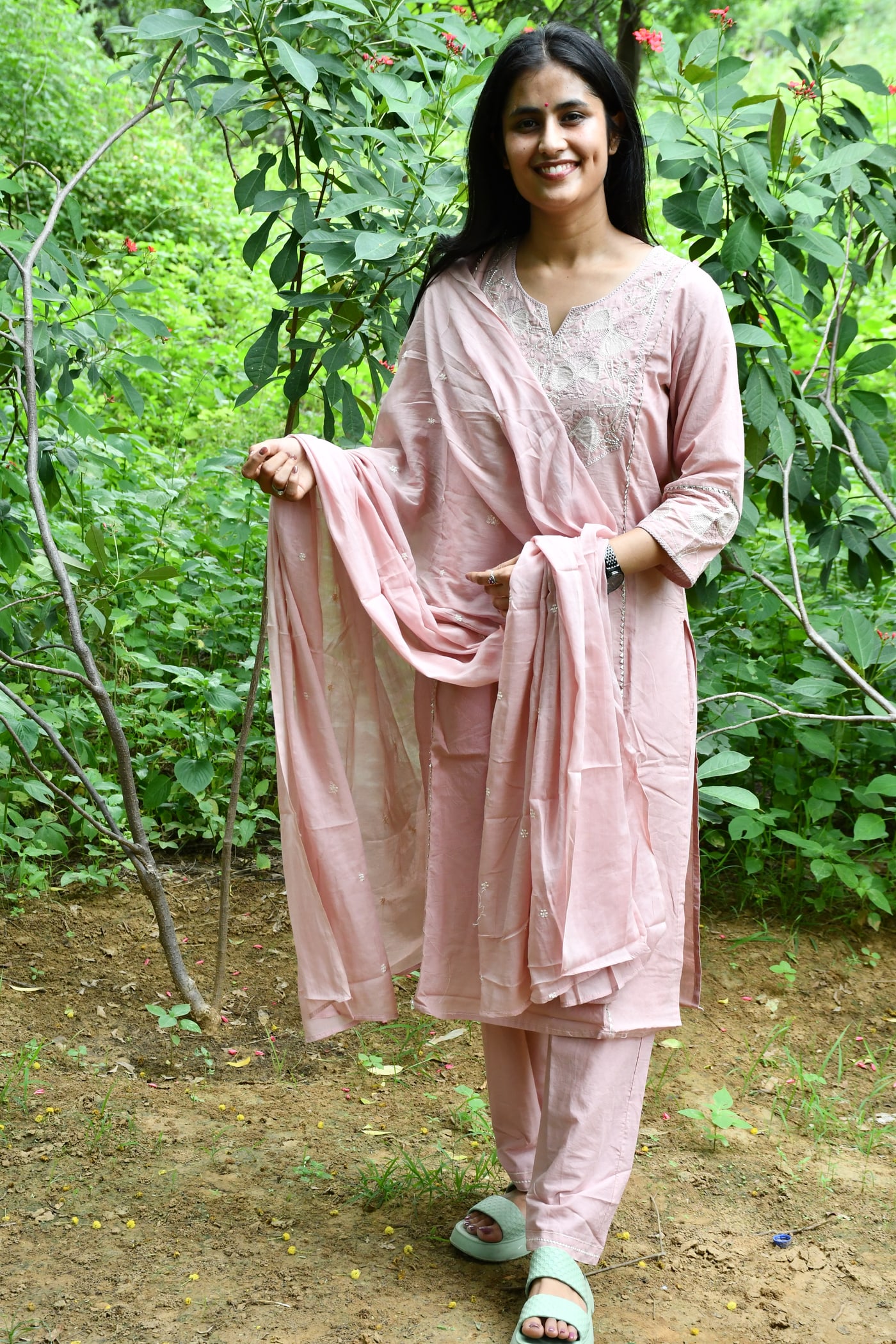 Dusty Rose cutwork suit set worn full length, dupatta held open