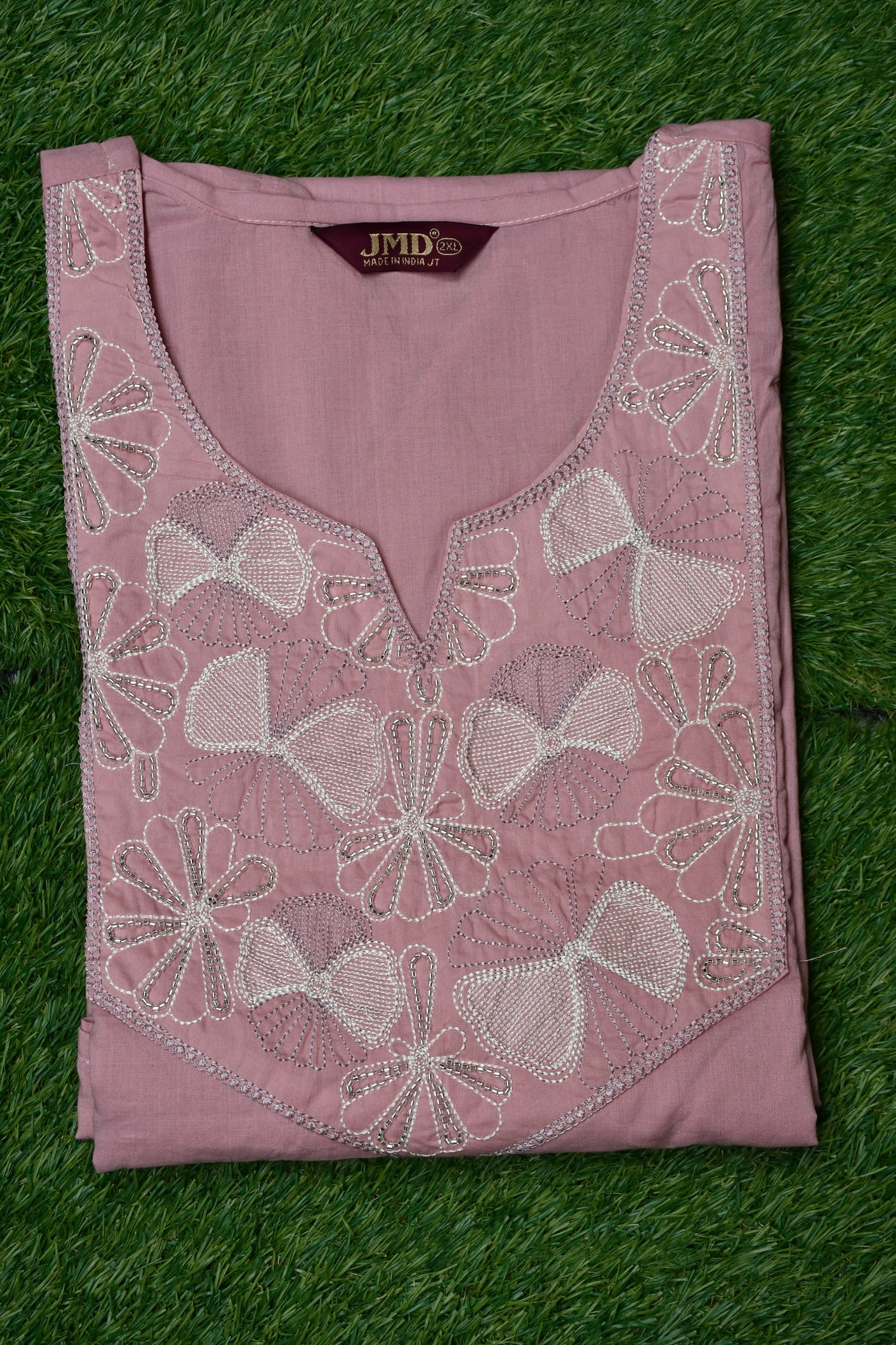 Dusty Rose kurta laid flat, cutwork petals around the neckline